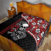 Red and black Halloween quilt on bed: skull and hibiscus flower graphics with triangle pattern