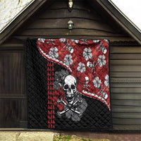 Red and black Halloween quilt hanging on wooden wall: skull graphic, hibiscus flowers, triangles