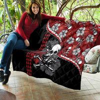 Red and black Halloween quilt held on sofa: skull, hibiscus flowers, and red triangle pattern