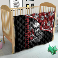 Red and black Halloween quilt on child bed: skull and hibiscus flower print, triangle panels
