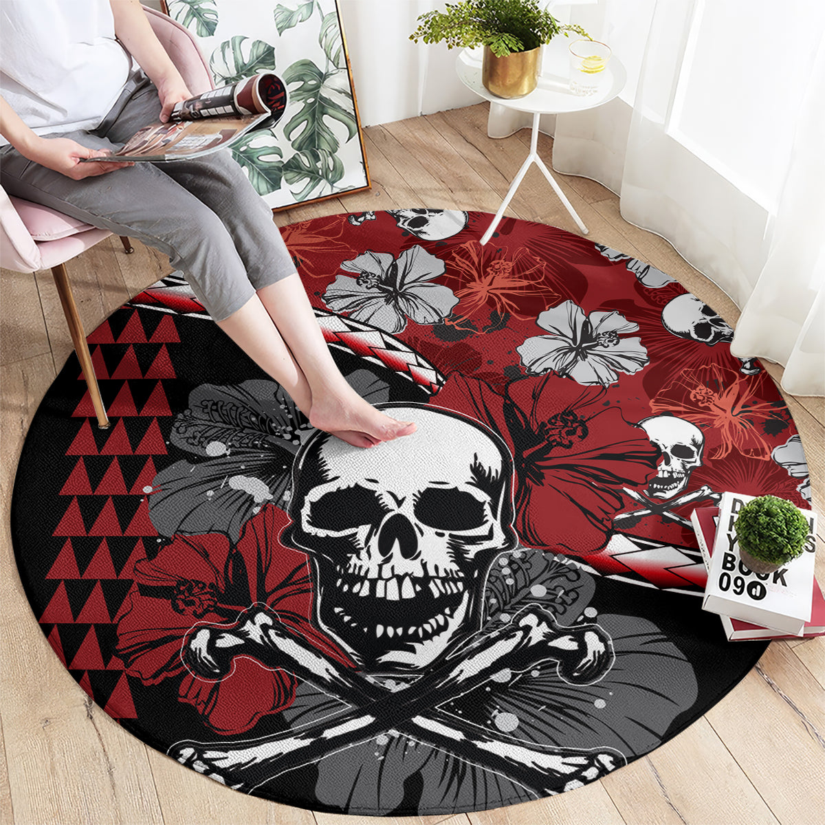 Round Halloween area rug with central skull graphic, hibiscus blooms, and red geometric accents