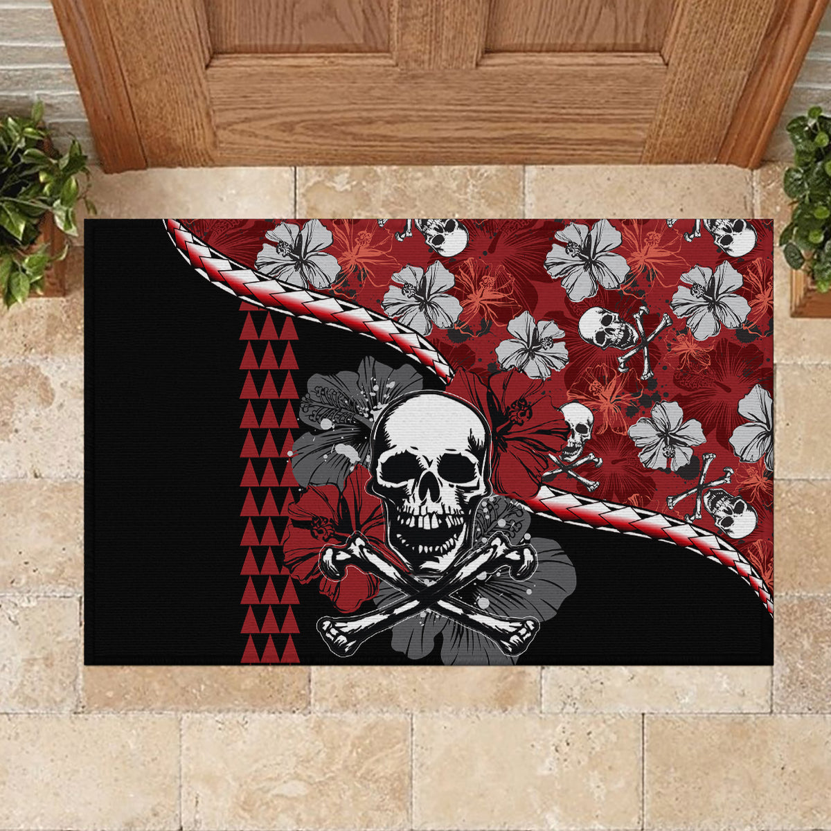 Red and black rubber doormat with central skull, hibiscus flowers, and rope-like outline.