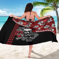 Red and black hibiscus skull sarong wrap with wide black border and tiki-style print