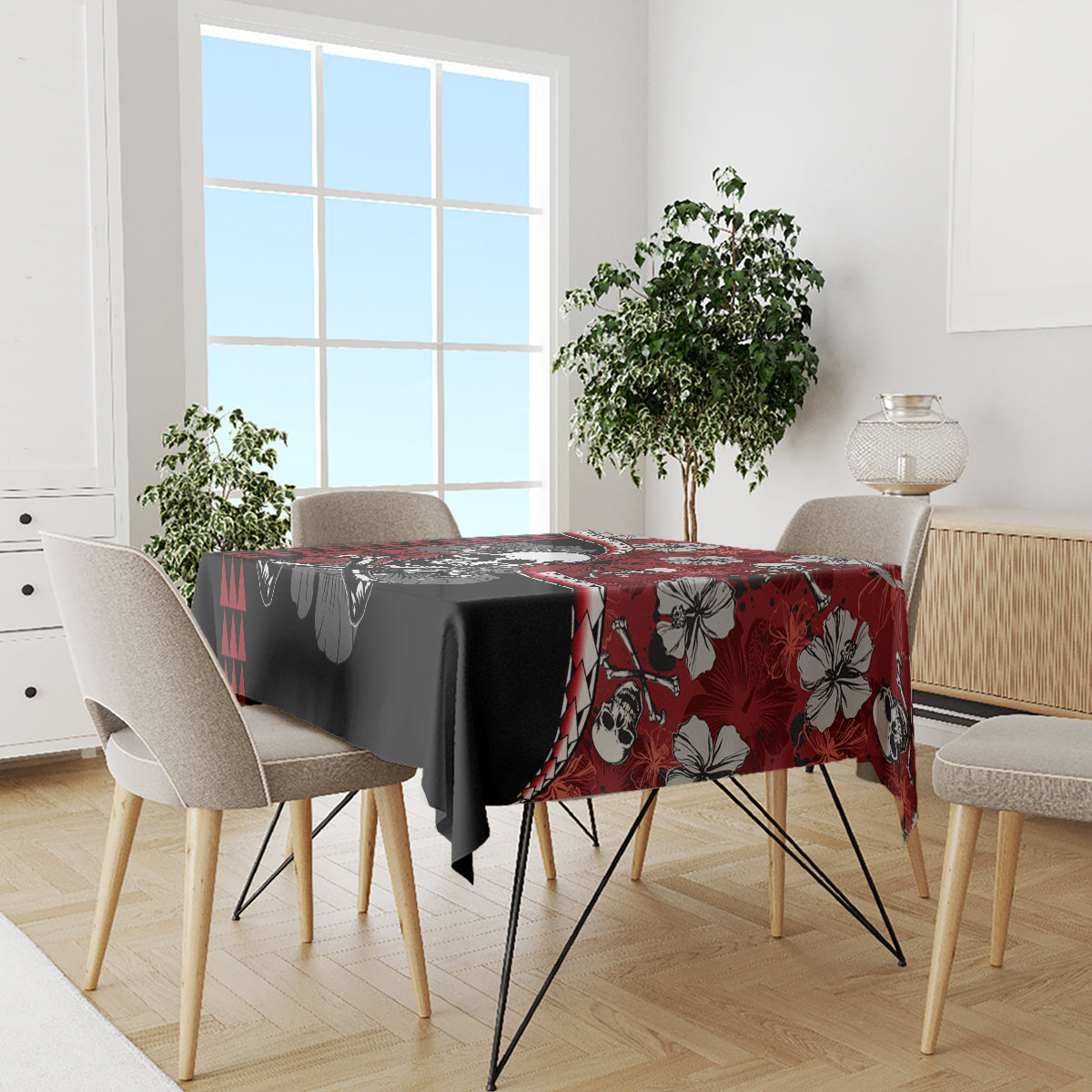 Red and black hibiscus skull Halloween tablecloth covering dining table with tableware