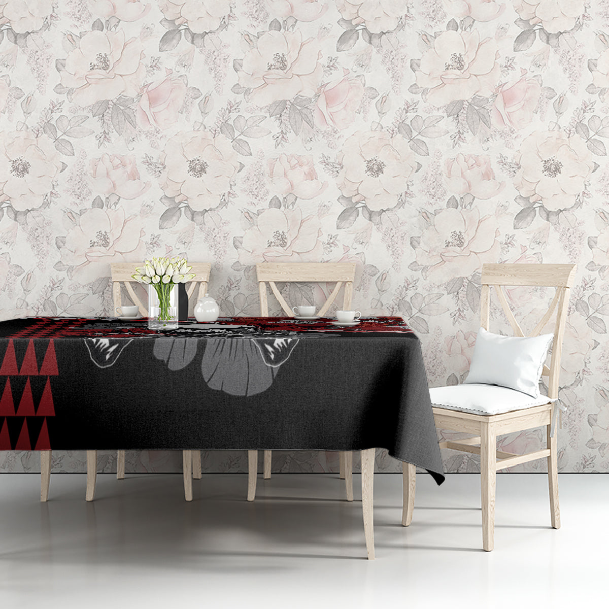 Red and black hibiscus skull Halloween tablecloth on table with floral hibiscus pattern