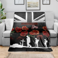 Black Remembrance Day blanket with poppy flowers and Union Jack stripe, draped on sofa