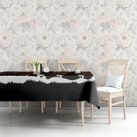 Black tablecloth with red poppies and white silhouette scene on dining table