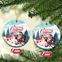 Oval ceramic Christmas ornament with Santa holding a hockey stick, “Merry Christmas”