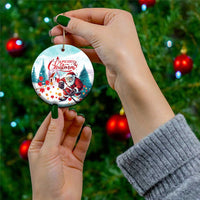Round ceramic Christmas ornament with Santa playing hockey and “Merry Christmas”
