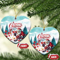 Heart-shaped ceramic Christmas ornament with Santa playing hockey, “Merry Christmas”