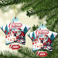Snowflake-shaped ceramic Christmas ornament with Santa hockey scene, “Merry Christmas”