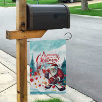 Mint garden flag on a yard post with Santa hockey and 'Merry Christmas' in red