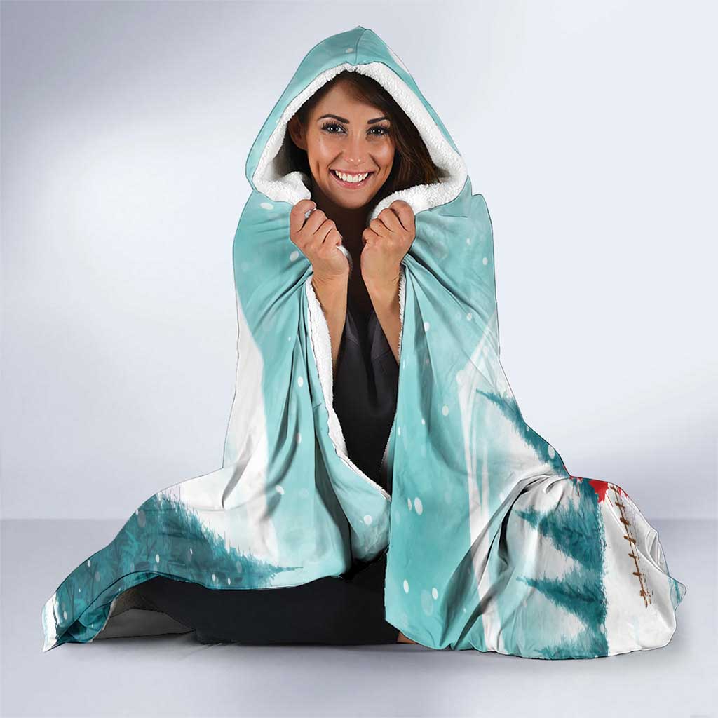 Mint hooded blanket with plush white hood lining and Santa hockey holiday design