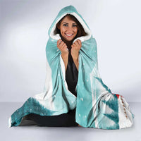 Mint hooded blanket with plush white hood lining and Santa hockey holiday design