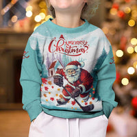 Kids mint Christmas sweater featuring Santa playing hockey and 'Merry Christmas' front