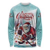 Mint long sleeve shirt with Merry Christmas Santa playing hockey front graphic