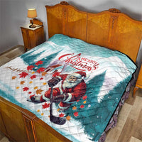 Mint Christmas quilt on bed, Santa hockey player graphic, 'Merry Christmas' center