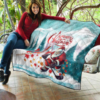 Mint Christmas quilt draped on patio seating, Santa hockey graphic and 'Merry Christmas'
