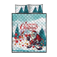 Mint Christmas quilt bed set with Santa playing hockey and two matching pillows.
