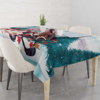 Mint teal Christmas tablecloth with Santa and hockey skates, draped across dining table