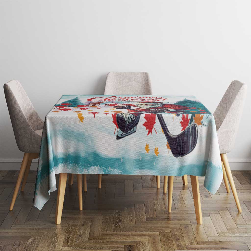 Christmas tablecloth with Santa and hockey skates, mint teal color, on dining table