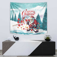 Mint Christmas tapestry with Santa skating and a hockey stick amid snowy evergreens