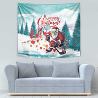 Christmas tapestry showing Santa playing hockey with red maple leaves and pine trees