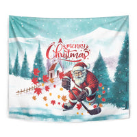 Close-up Christmas tapestry with Santa playing hockey, snowy hills and evergreen trees