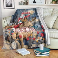 Holiday blanket: Santa riding a moose on a starry night with “Merry Christmoose”