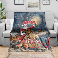 Holiday blanket draped on a sofa, Santa riding a moose under a starry night sky
