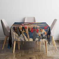 Square tablecloth with blue forest and leaf pattern on dining table