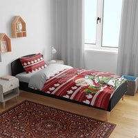 Red Christmas bedding set with maple leaf pattern, Santa and tree artwork on bed with two pillows