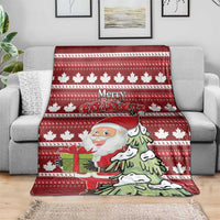 Red Christmas throw blanket draped over sofa with Santa, dog, and festive “Merry Christmas” text