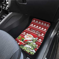Red car floor mat with Santa and tree graphic and white maple leaf border