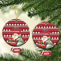 Red ceramic Christmas ornament, round maple leaf pattern with Santa and Merry Christmas; front/back tags.