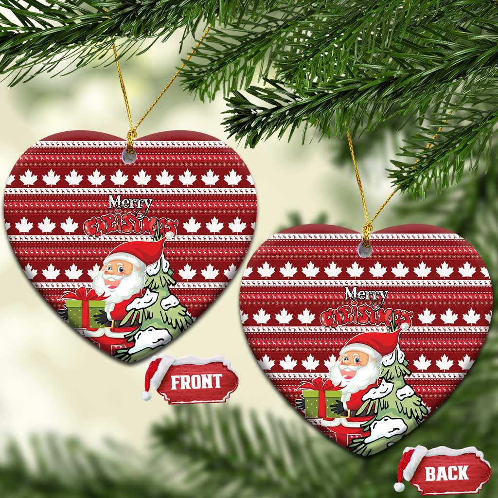 Red ceramic heart-shaped Christmas ornament with hanging loop; Santa and Merry Christmas over maple leaf stripes.
