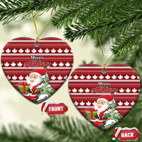Red ceramic heart-shaped Christmas ornament with hanging loop; Santa and Merry Christmas over maple leaf stripes.