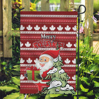 Red Christmas garden flag with maple leaf border, Santa beside green tree and gift