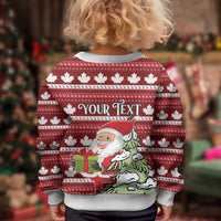 Kids red ugly Christmas sweater with maple leaf pattern, Santa holding gifts