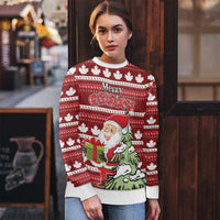 Red ugly Christmas sweater worn by model: Santa with gift, “Merry Christmas,” maple leaf pattern