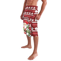 Red Christmas print shorts with Santa face, maple leaves and striped band