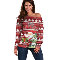 Red off-shoulder Christmas sweater with maple leaf pattern and Santa graphic