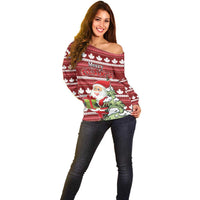 Red off-shoulder Christmas sweater with maple leaf stripes and Santa holding gifts