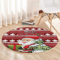 Red round Christmas area rug with maple leaf stripes and Santa artwork