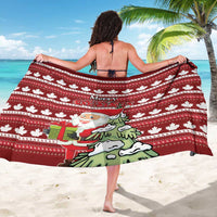 Red Christmas sarong with Santa and tree graphic, white maple leaf stripes