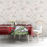 Red Christmas tablecloth on dining table with Santa cartoon and scattered maple leaf pattern
