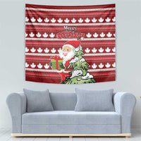 Red Christmas tapestry with white maple leaf stripes, “Merry Christmas,” Santa carrying a green gift bag.
