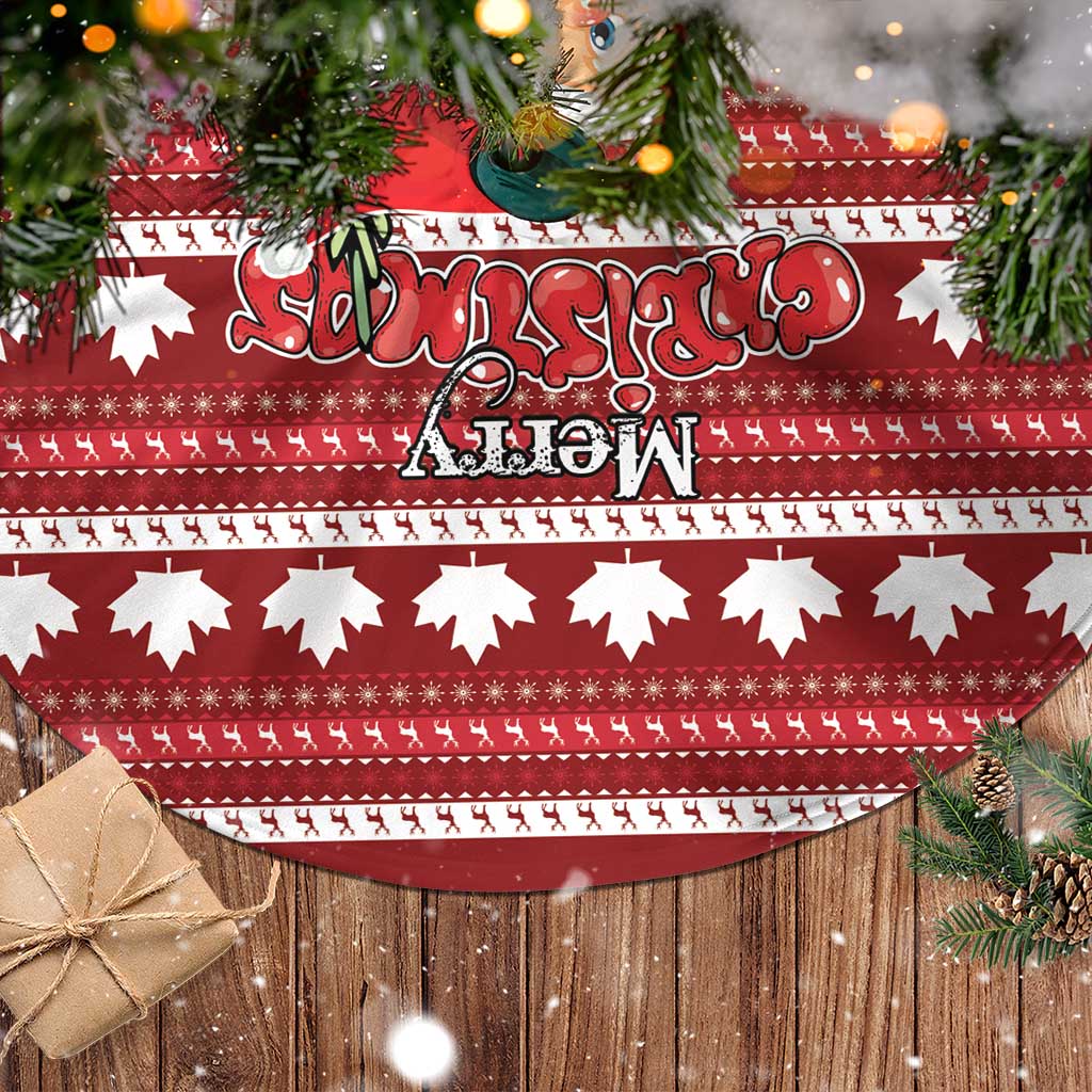 Red tree skirt with maple leaf print and fringe edge, laid on a surface