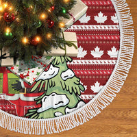 Red Christmas tree skirt with maple leaf print, illustrated scene, and white fringe trim