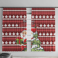 Red Christmas window curtain with maple leaf pattern and Santa and tree illustration.